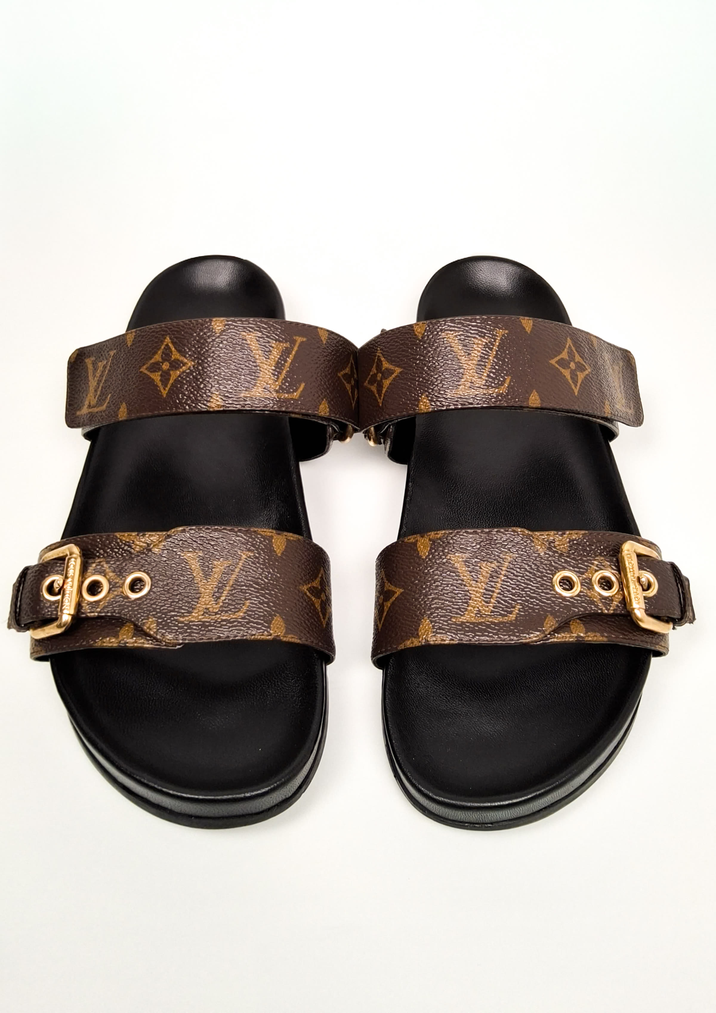 Monogram sandals by Louis Vuitton, on completion
