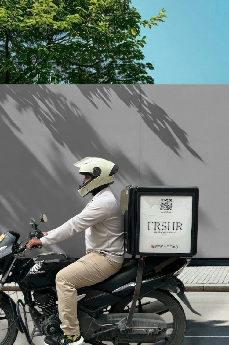 A FRSHR driver collecting a piece by motorbike